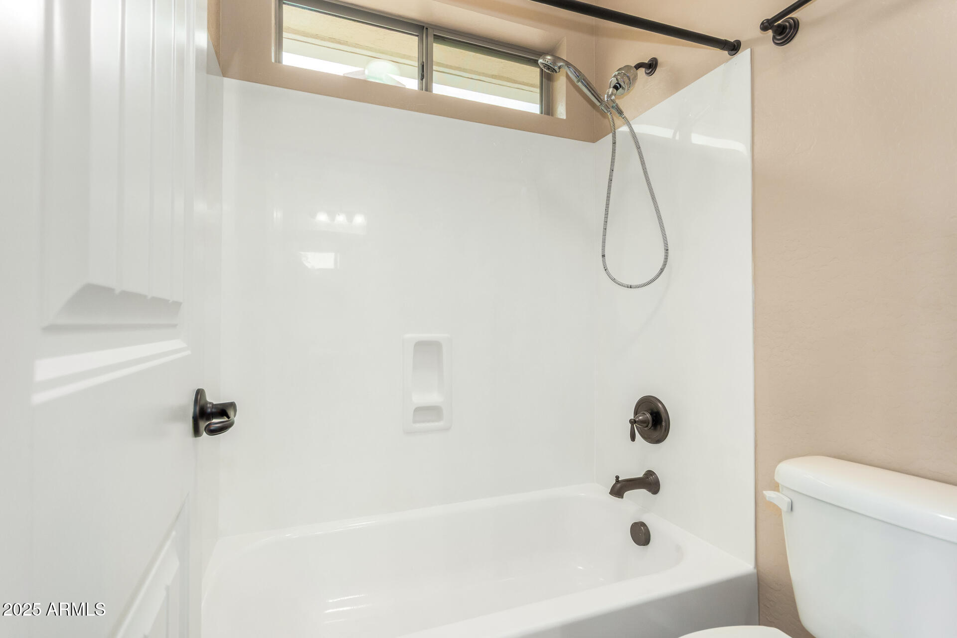 3540 East Mesquite Street Gilbert, AZ 85296 - Photo 41 of 55 a bathroom with a bath tub with a shower