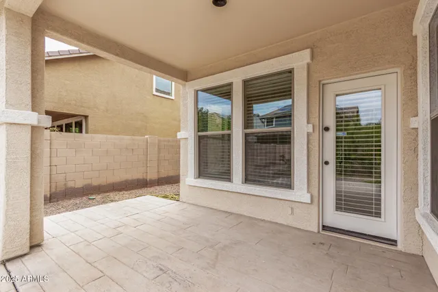 a view of an empty room with glass door