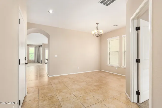 a view of a hallway with a chandelier