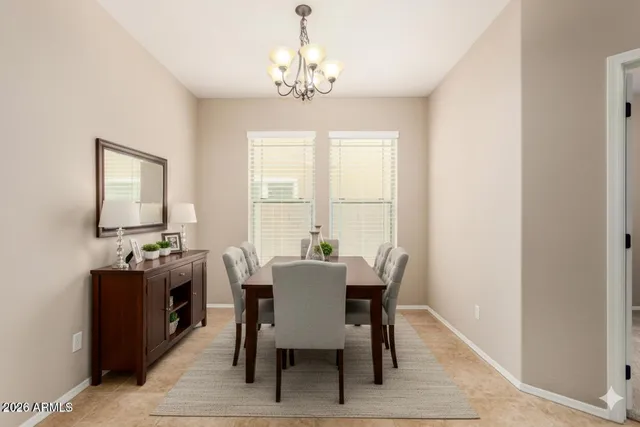 a view of a dining room with furniture and window
