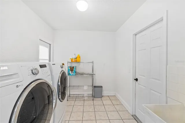 a utility room with dryer and washer