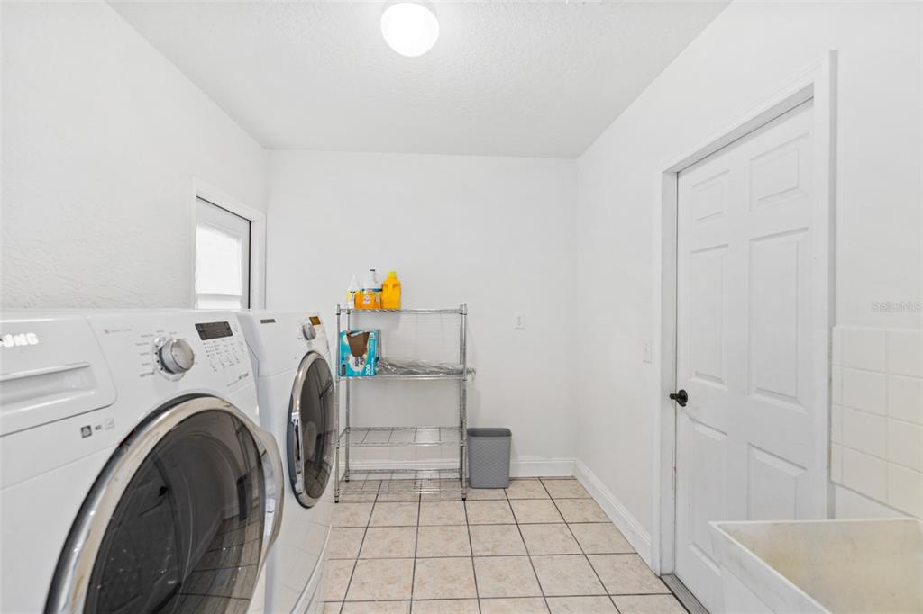 26 Marjorie Trail Ormond Beach, FL 32174 - Photo 11 of 30 a utility room with dryer and washer
