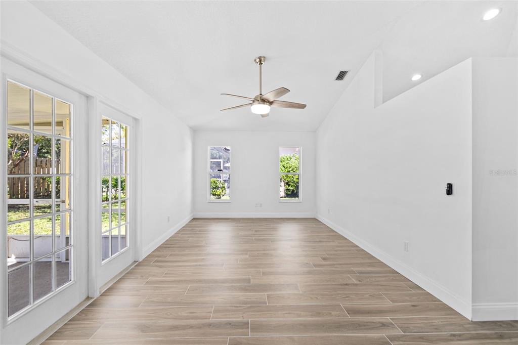 26 Marjorie Trail Ormond Beach, FL 32174 - Photo 13 of 30 wooden floor in an empty room with a window