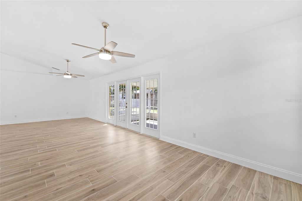 26 Marjorie Trail Ormond Beach, FL 32174 - Photo 14 of 30 wooden floor in an empty room with a window