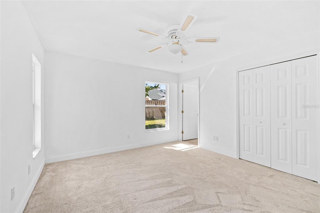 26 Marjorie Trail Ormond Beach, FL 32174 - Photo 18 of 30 an empty room with fan and windows