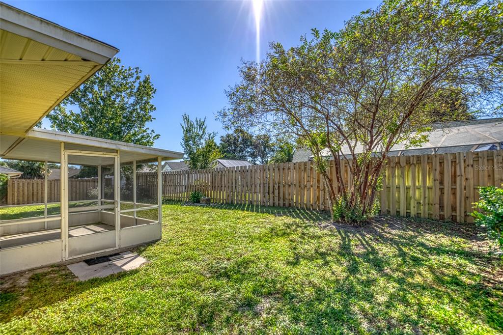 26 Marjorie Trail Ormond Beach, FL 32174 - Photo 23 of 30 a view of a backyard with a small cabin