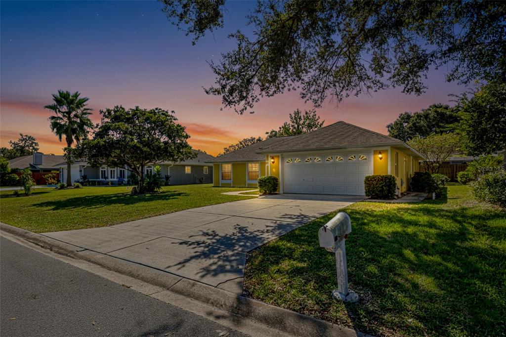 26 Marjorie Trail Ormond Beach, FL 32174 - Photo 3 of 30 a front view of a house with a yard and garage