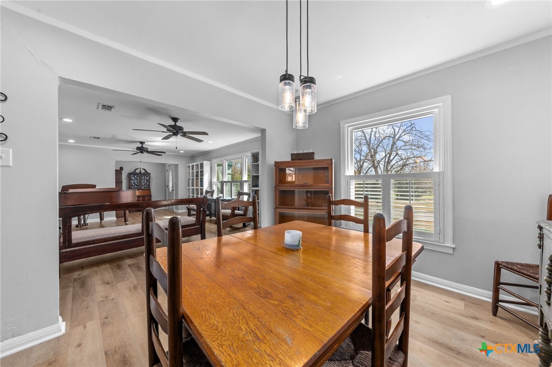 420 King Circle Temple, TX 76501 - Photo 5 of 27 a dining room with furniture a chandelier and wooden floor