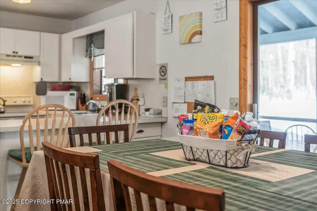 a view of a dining room with furniture window and outside view