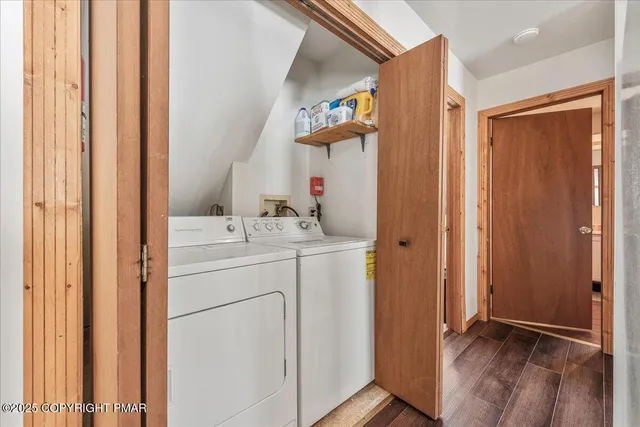 a spacious bathroom with a double vanity sink a mirror and a toilet