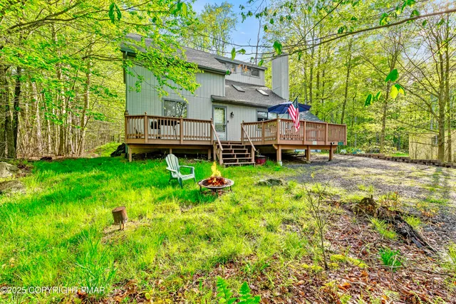 a view of a house with a yard porch and sitting area