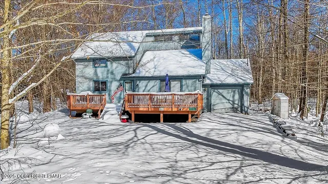 a view of a backyard with sitting area