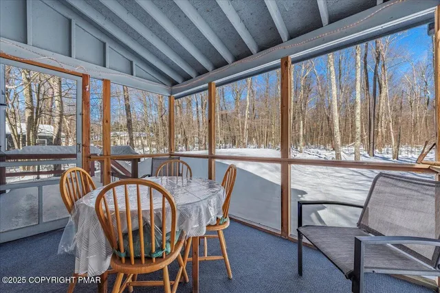 a view of a dining room with furniture window and outside view