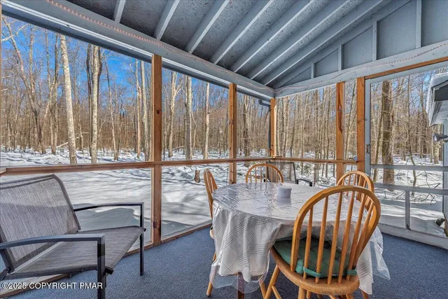a view of a balcony with chairs