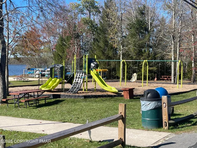 a view of backyard with swimming pool