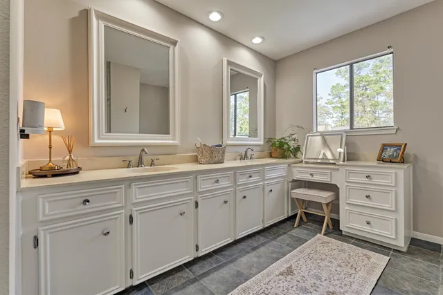 a bathroom with a bathtub and window