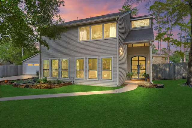 a front view of a house with garden