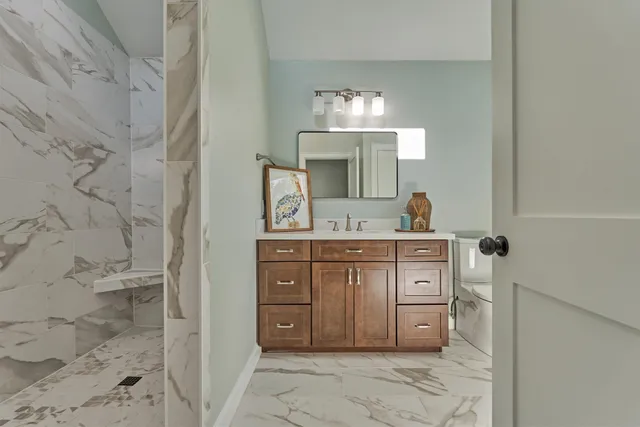 a view of a backyard with couches table and chairs
