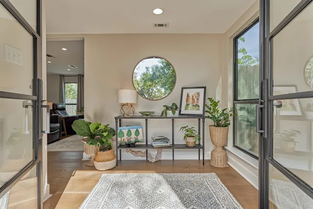 a view of a dining room with furniture window and wooden floor