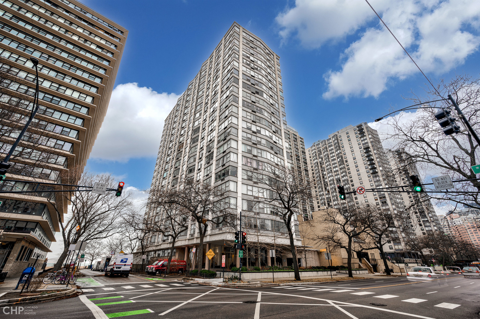 a view of a city street lined with buildings and trees