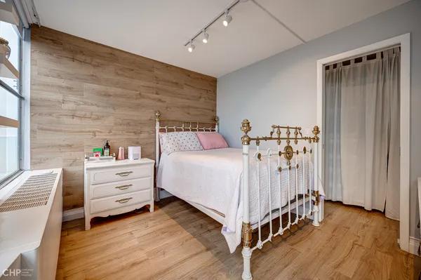 a bed room with a bed and a window