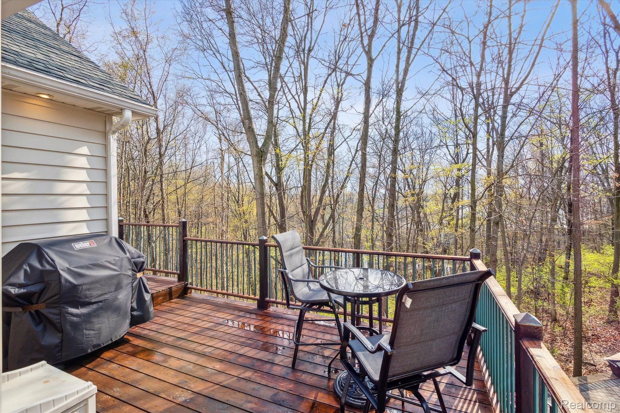 2659 West Coon Lake Road Howell, MI 48843 - Photo 7 of 45 Upper deck convenient for grilling, enjoy a coffee