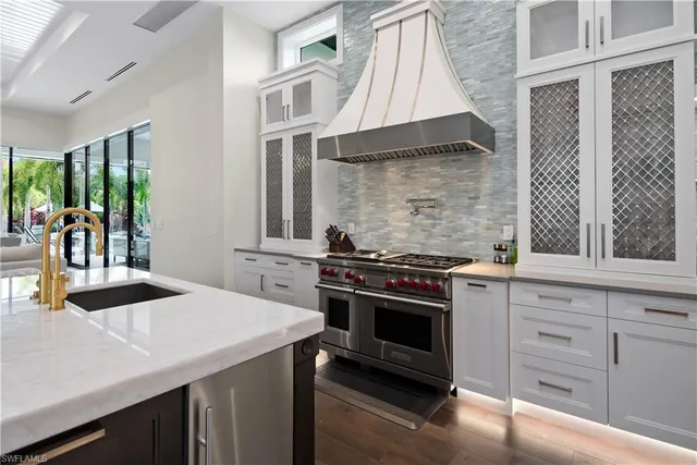 a kitchen with a stove and a sink