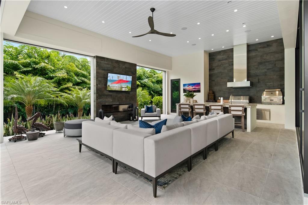 882 Cassena Road Naples, FL 34108 - Photo 8 of 46 Lanai with electric screens and shutters