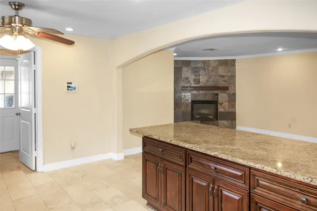 a kitchen with a sink and a refrigerator