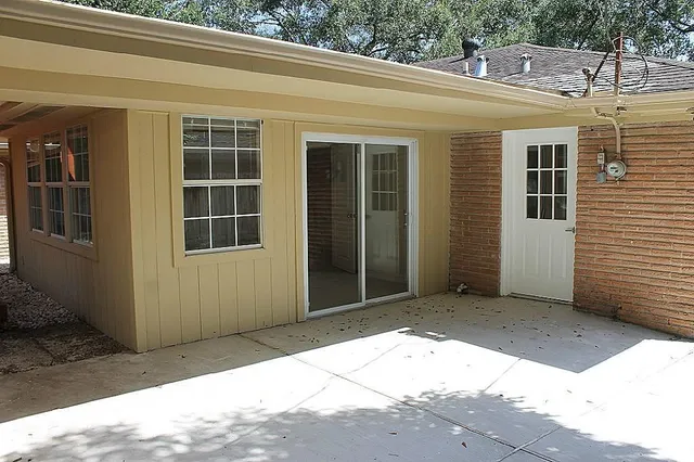 a view of a house with a door and wooden floor