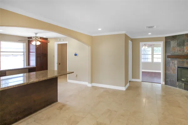a view of a hallway with windows
