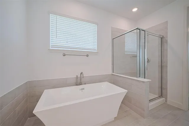 a white bath tub sitting in a bathroom
