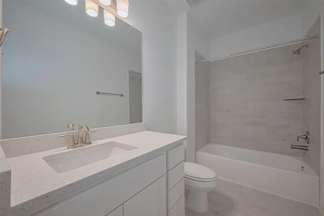 a bathroom with a sink a toilet and a bathtub