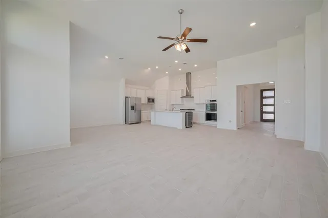 a view of a livingroom and a kitchen