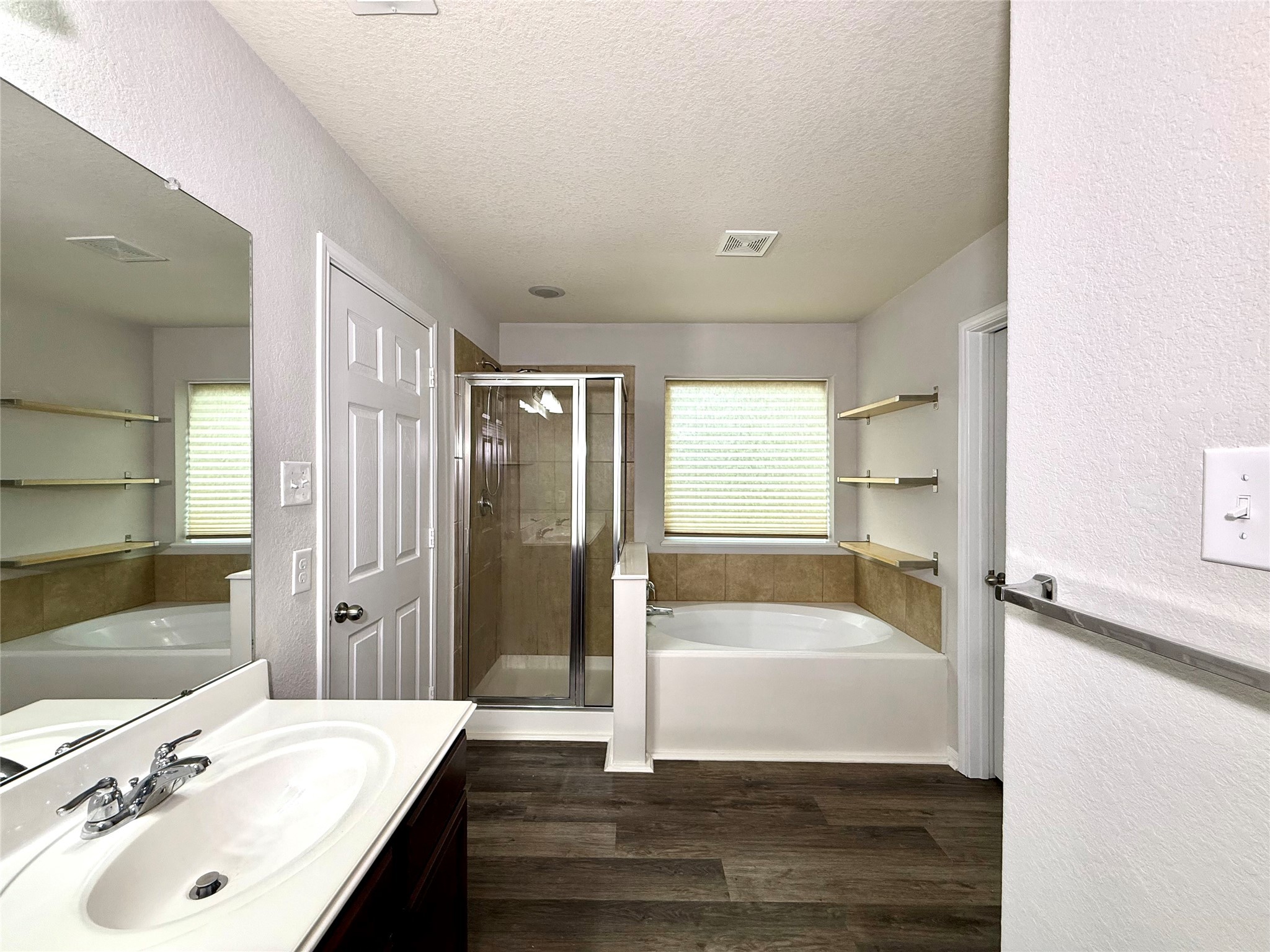 10646 Chestnut Path Way Tomball, TX 77375 - Photo 15 of 22 a bathroom with a tub shower sink and mirror