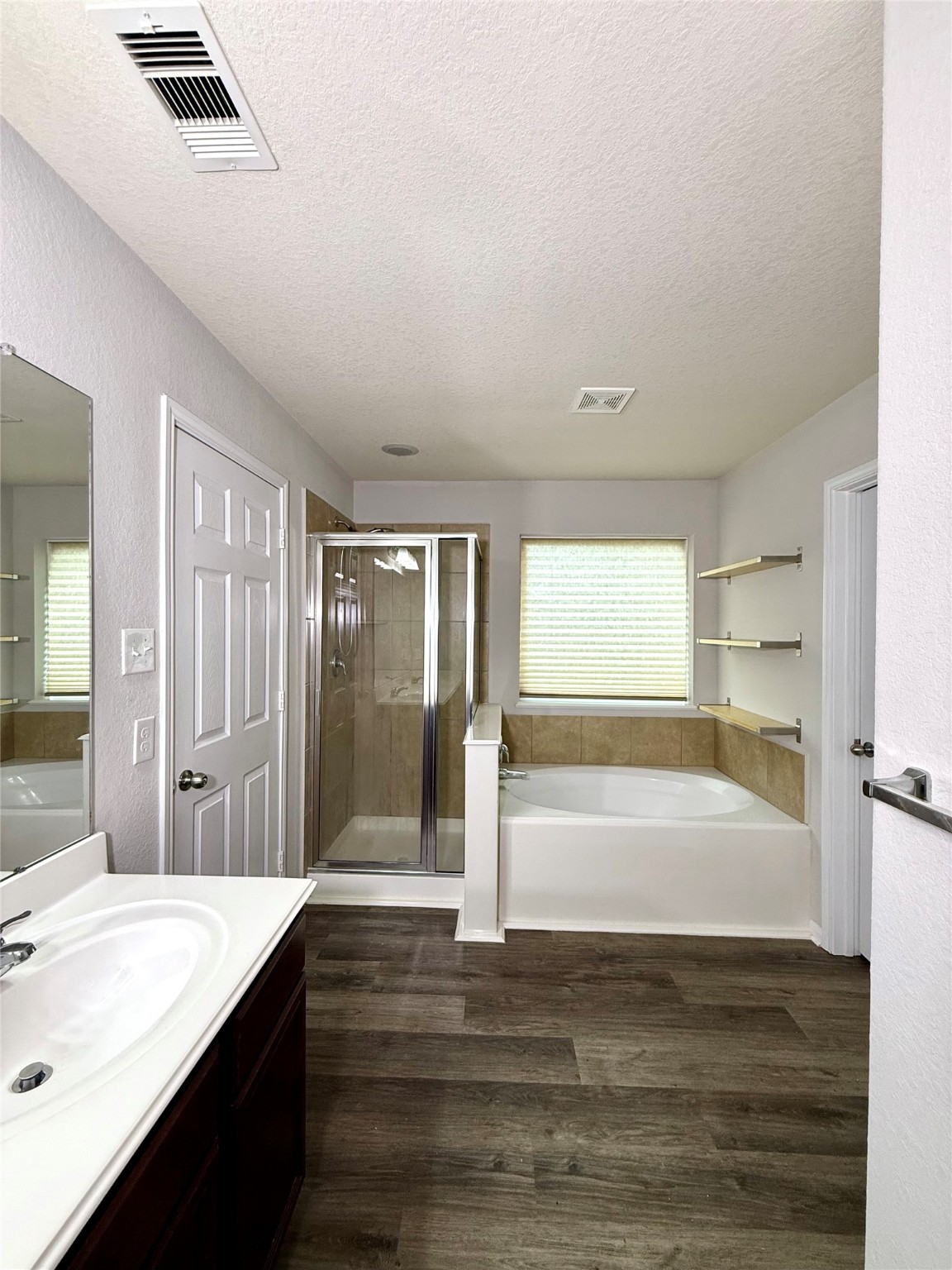 10646 Chestnut Path Way Tomball, TX 77375 - Photo 16 of 22 a bathroom with a bathtub and a sink