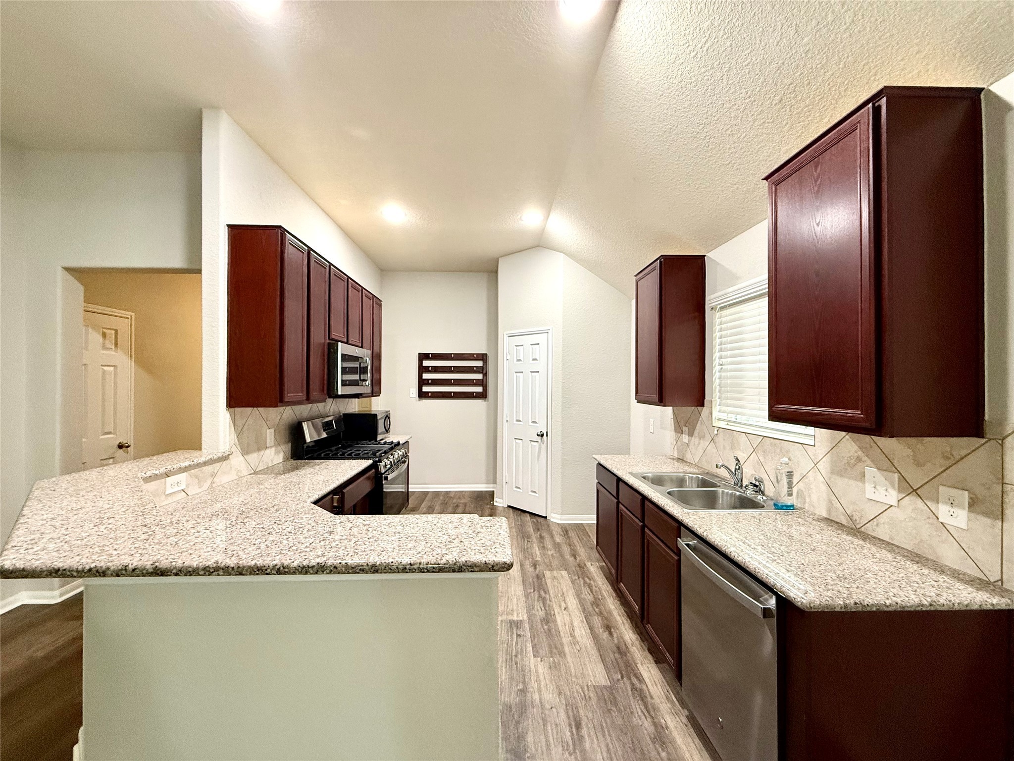 10646 Chestnut Path Way Tomball, TX 77375 - Photo 6 of 22 a bathroom with a granite countertop sink and a mirror