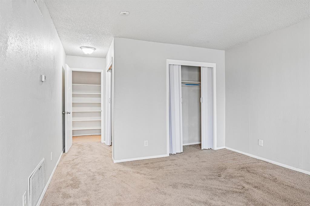 5534 Boca Raton Boulevard, Unit 292 Fort Worth, TX 76112 - Photo 29 of 31 an empty room with closet and a bathroom