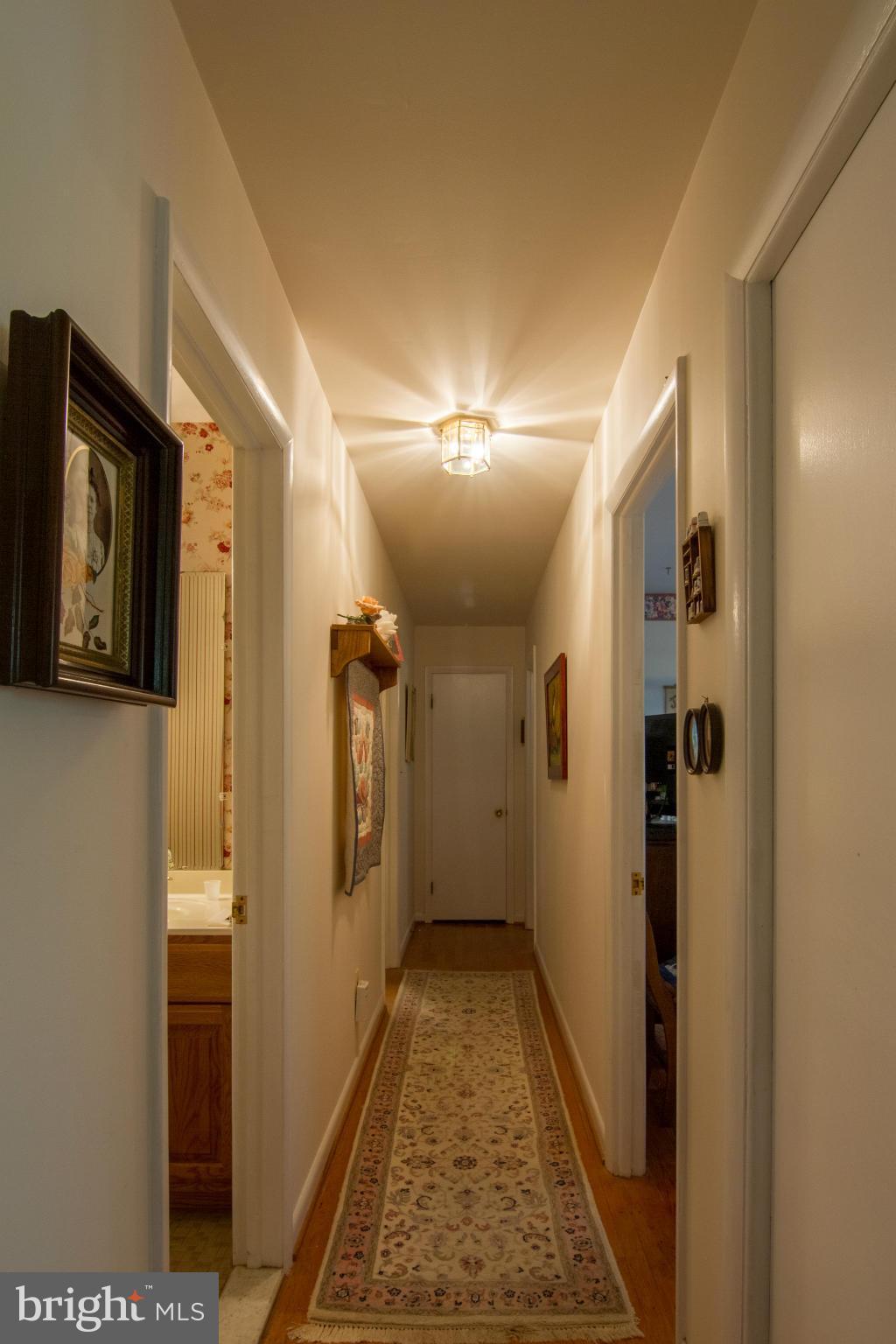 4609 Carroll Manor Road Baldwin, MD 21013 - Photo 17 of 29 Hallway to bedrooms - wood floors