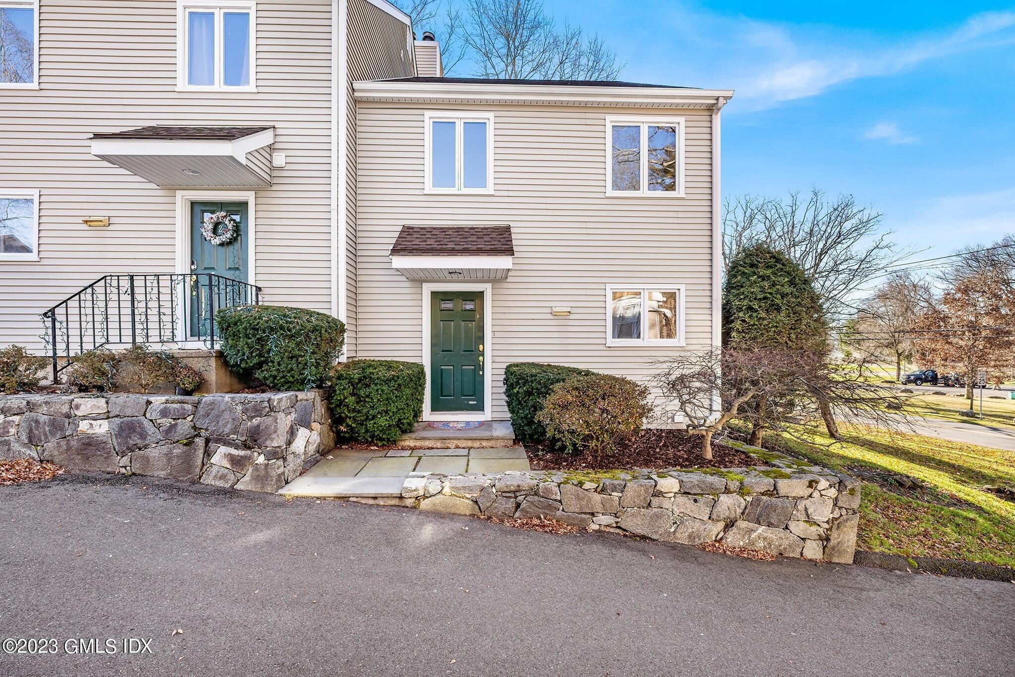 53 Bible Street, Unit 1 Cos Cob, CT 06807 - Photo 1 of 14 a view of a house with a yard