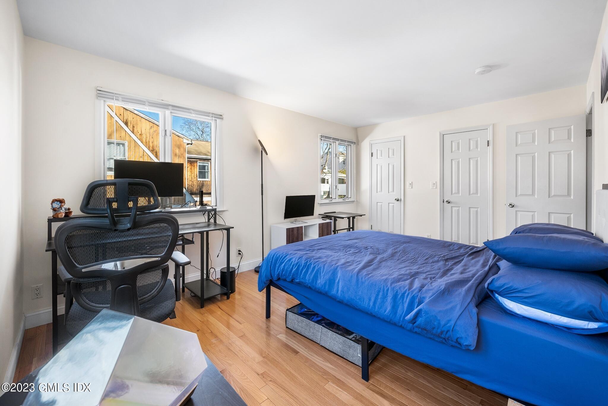 53 Bible Street, Unit 1 Cos Cob, CT 06807 - Photo 12 of 14 a bedroom with a bed and a window