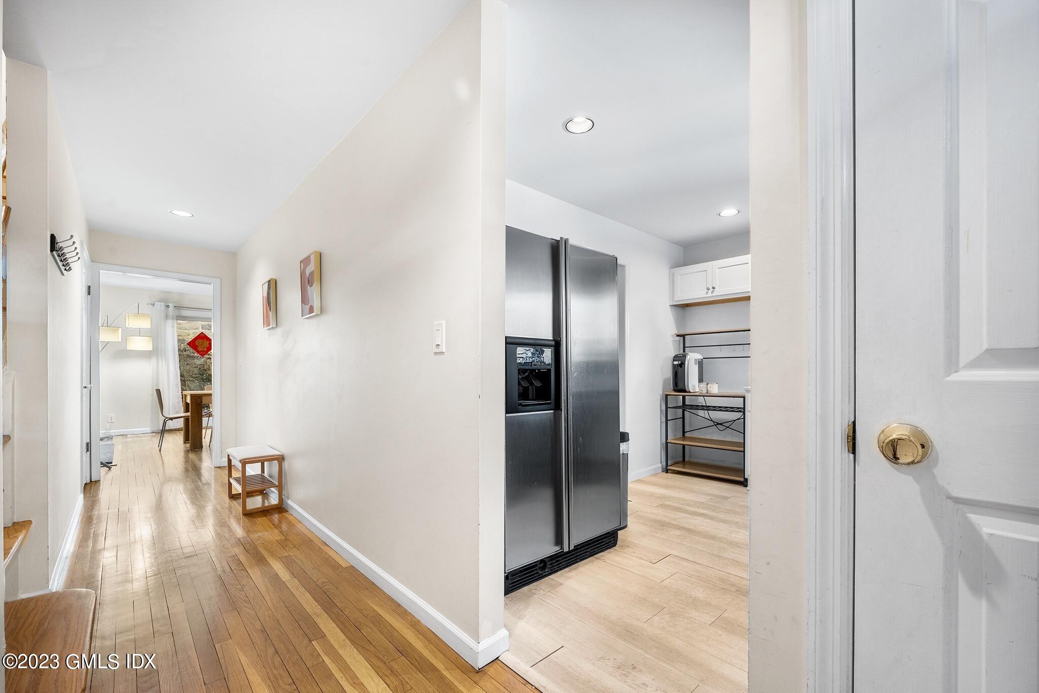53 Bible Street, Unit 1 Cos Cob, CT 06807 - Photo 2 of 14 a view of a kitchen from the hallway