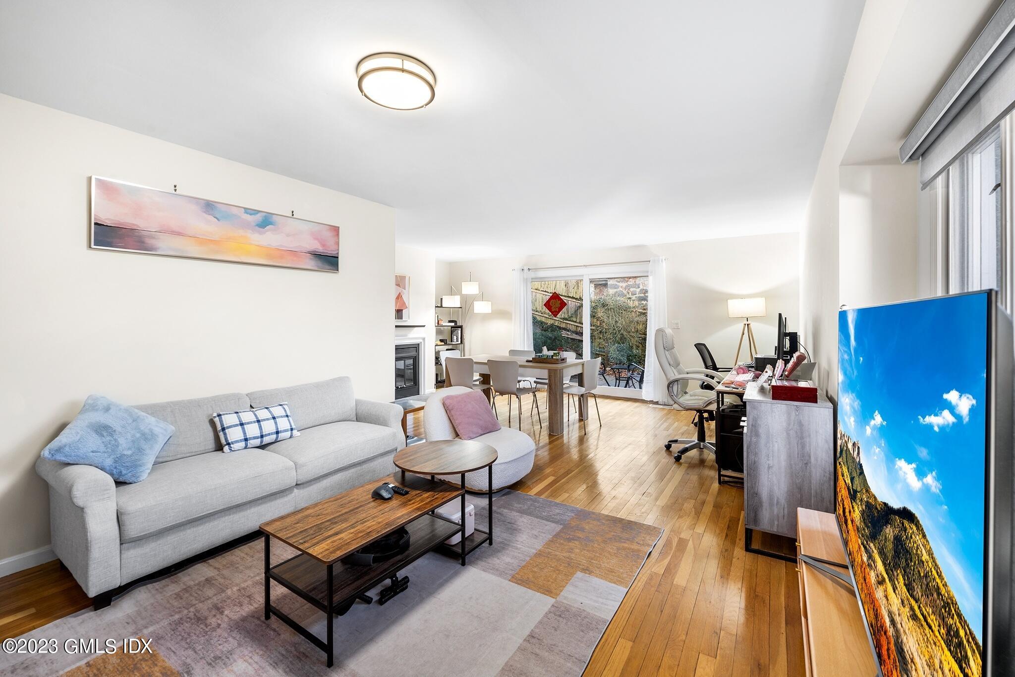 53 Bible Street, Unit 1 Cos Cob, CT 06807 - Photo 5 of 14 a living room with furniture and a rug