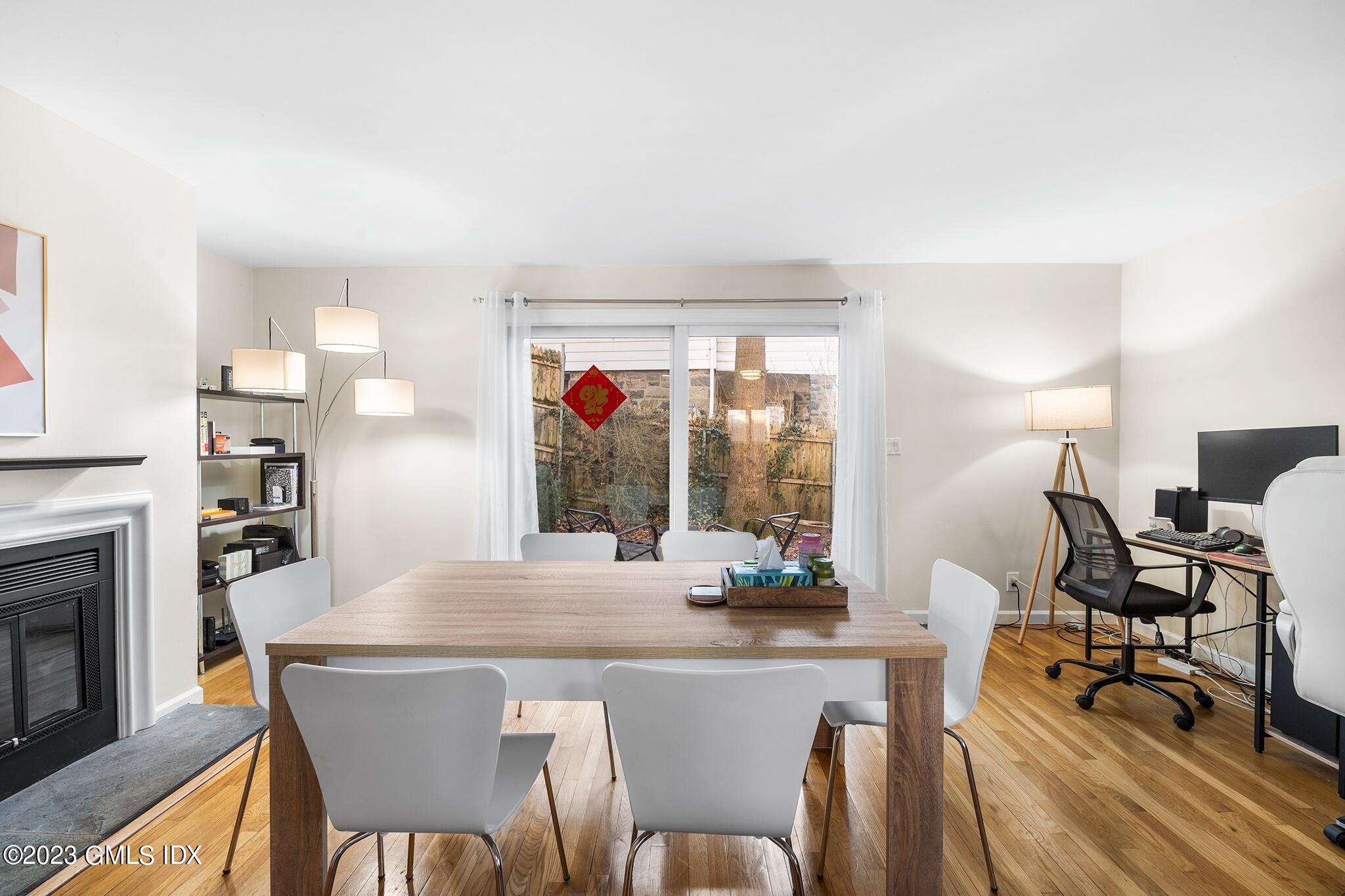 53 Bible Street, Unit 1 Cos Cob, CT 06807 - Photo 6 of 14 a dining room with furniture and wooden floor