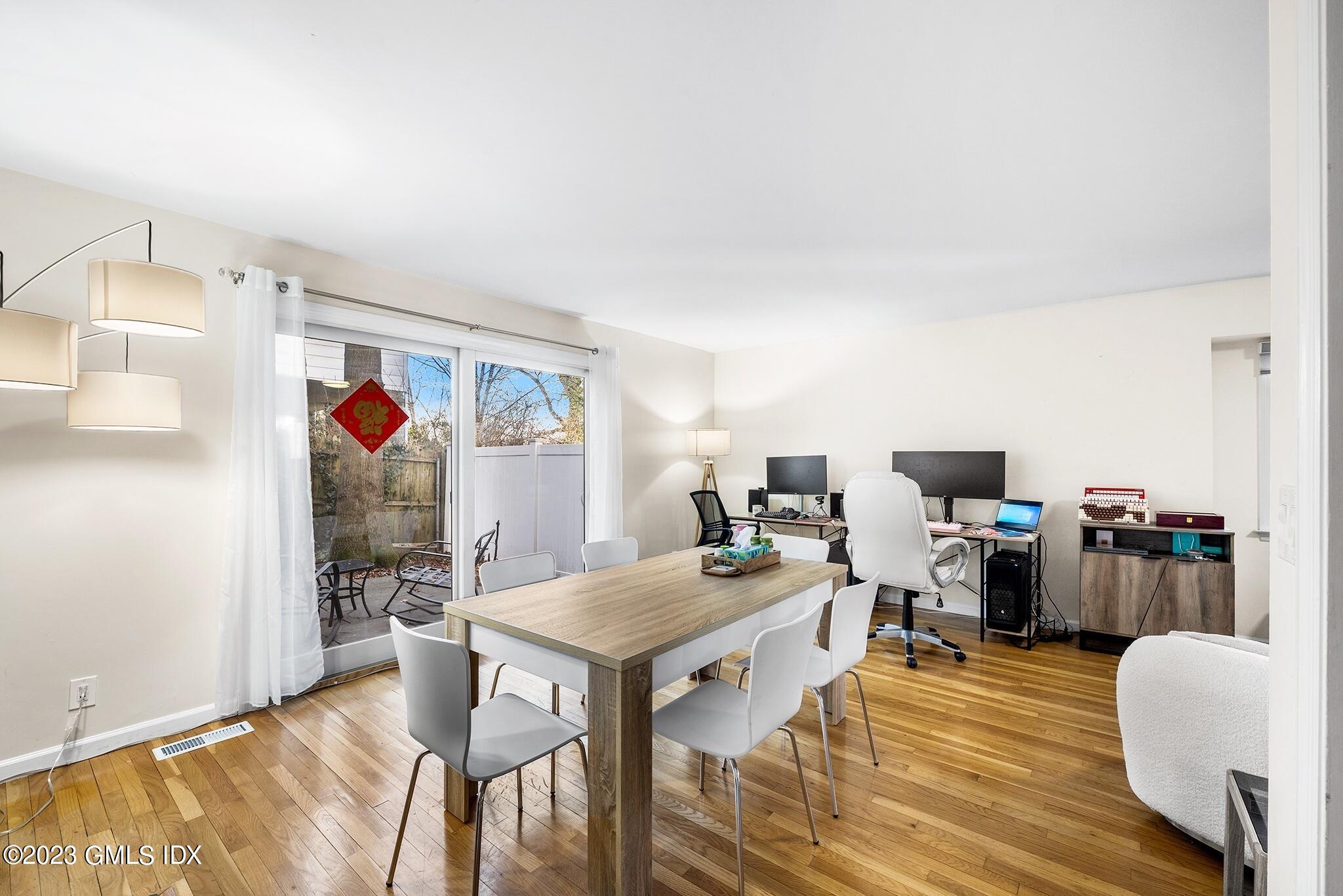 53 Bible Street, Unit 1 Cos Cob, CT 06807 - Photo 7 of 14 a view of a dining room with furniture