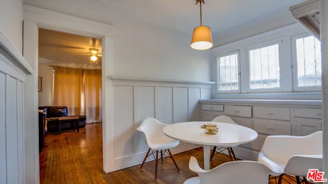 a view of a dining room with furniture window and wooden floor