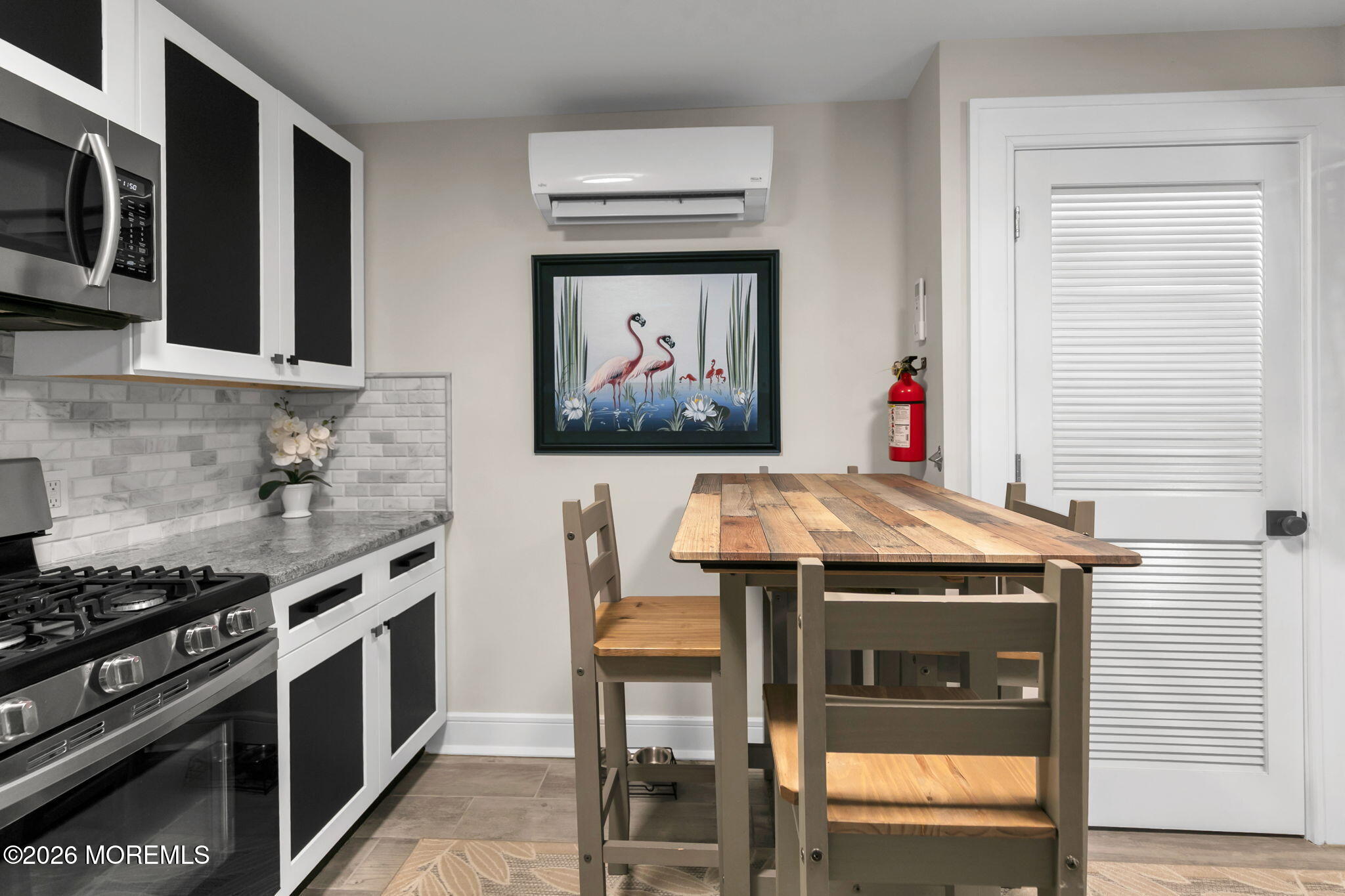 1301 Ocean Avenue, Unit 2 Point Pleasant Beach, NJ 08742 - Photo 11 of 31 a kitchen with a stove and a microwave