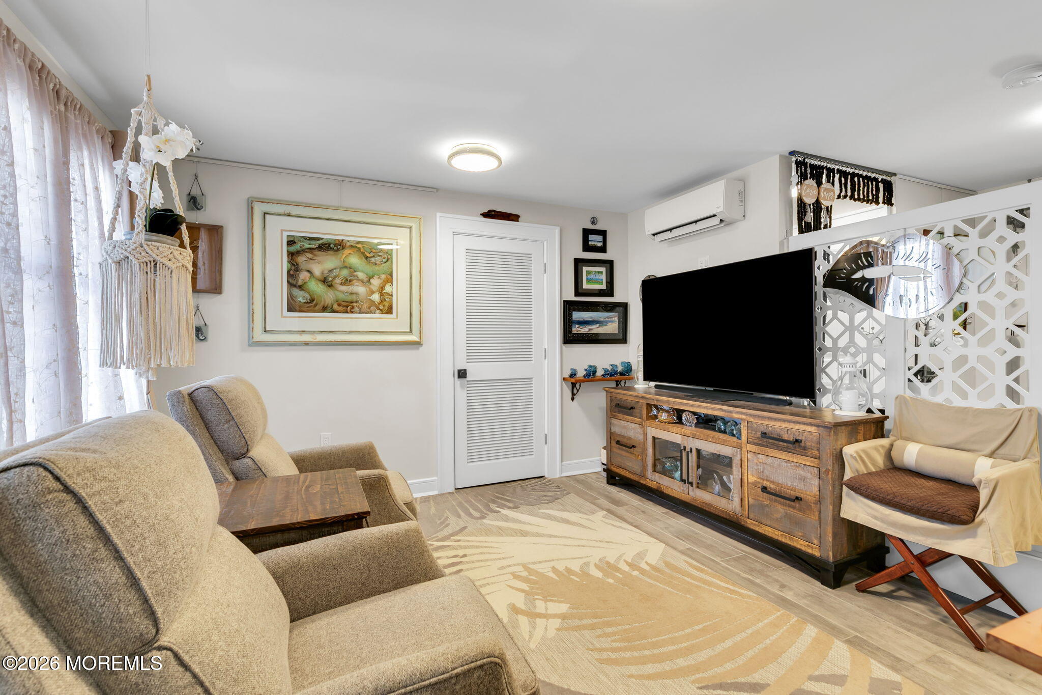 1301 Ocean Avenue, Unit 2 Point Pleasant Beach, NJ 08742 - Photo 15 of 31 a living room with furniture and a flat screen tv