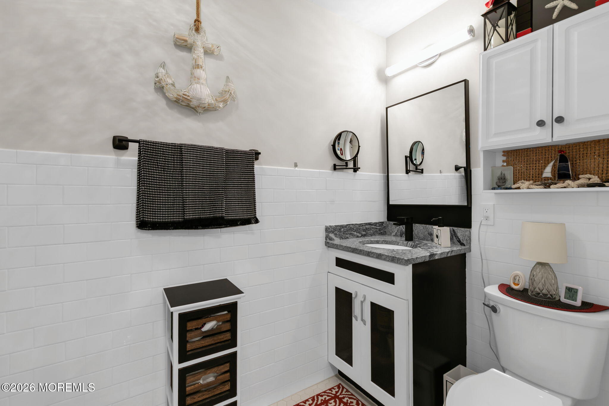1301 Ocean Avenue, Unit 2 Point Pleasant Beach, NJ 08742 - Photo 21 of 31 a view of a kitchen with a stove wooden floor and cabinets