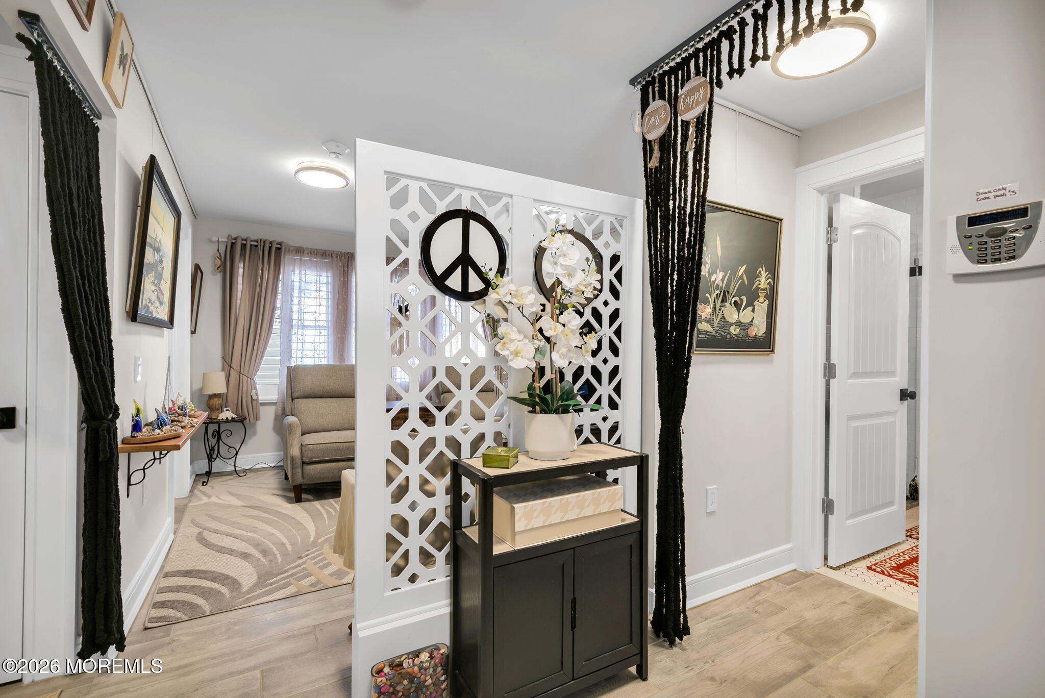 1301 Ocean Avenue, Unit 2 Point Pleasant Beach, NJ 08742 - Photo 23 of 31 a view of a hallway with wooden floor and furniture